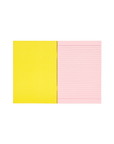 Socolo notebook, open showing its pink paper pages, lined with pink ink and a yellow inner cover.
