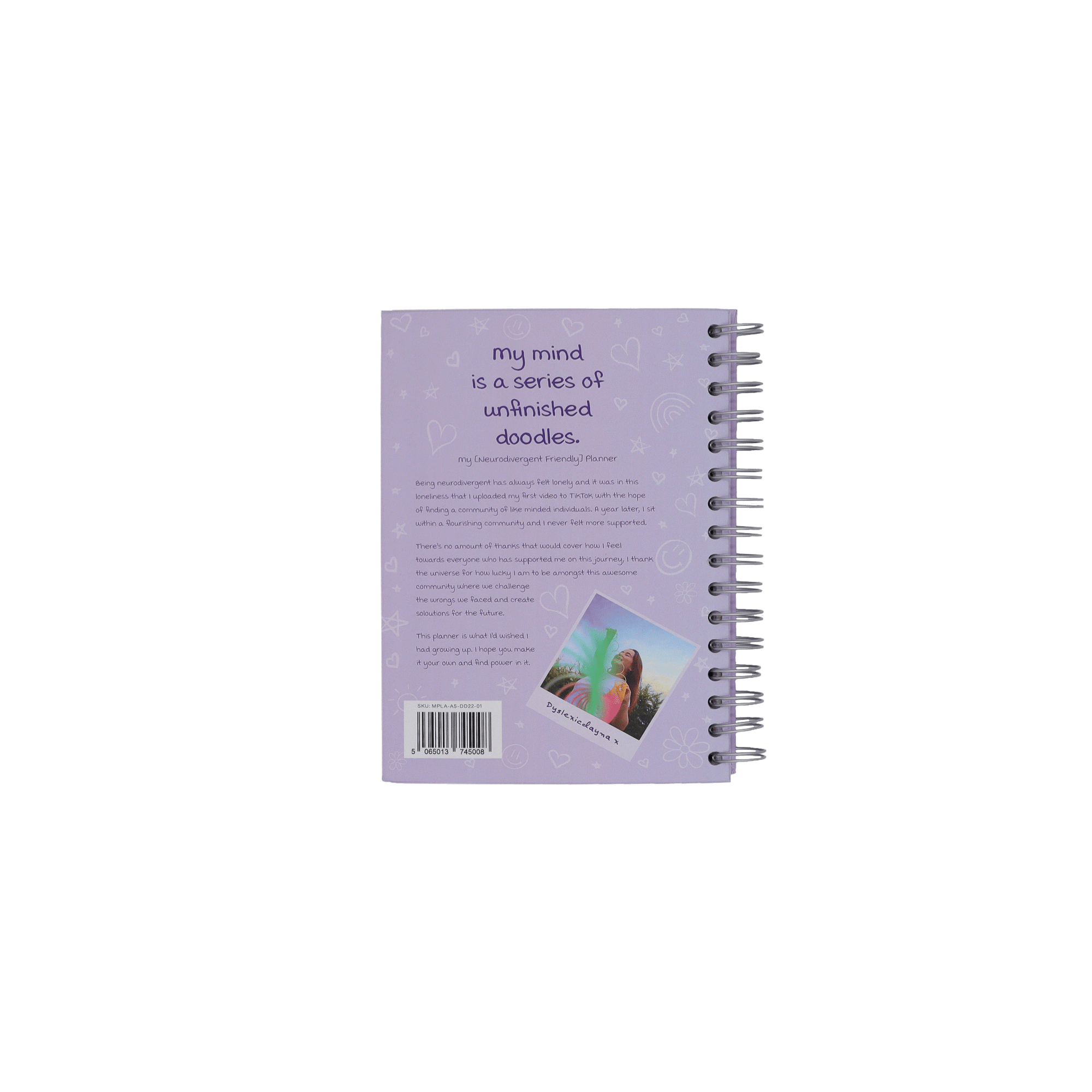 The back of the purple planner called My mind is a series of unfinished doodles. There is a picture of Dayna playing with a rainbow slinky. 
